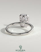Kynora CJ 2ct radiant bezel solitaire engagement ring with petal gallery design, showcasing a central gemstone and intricate band details.
