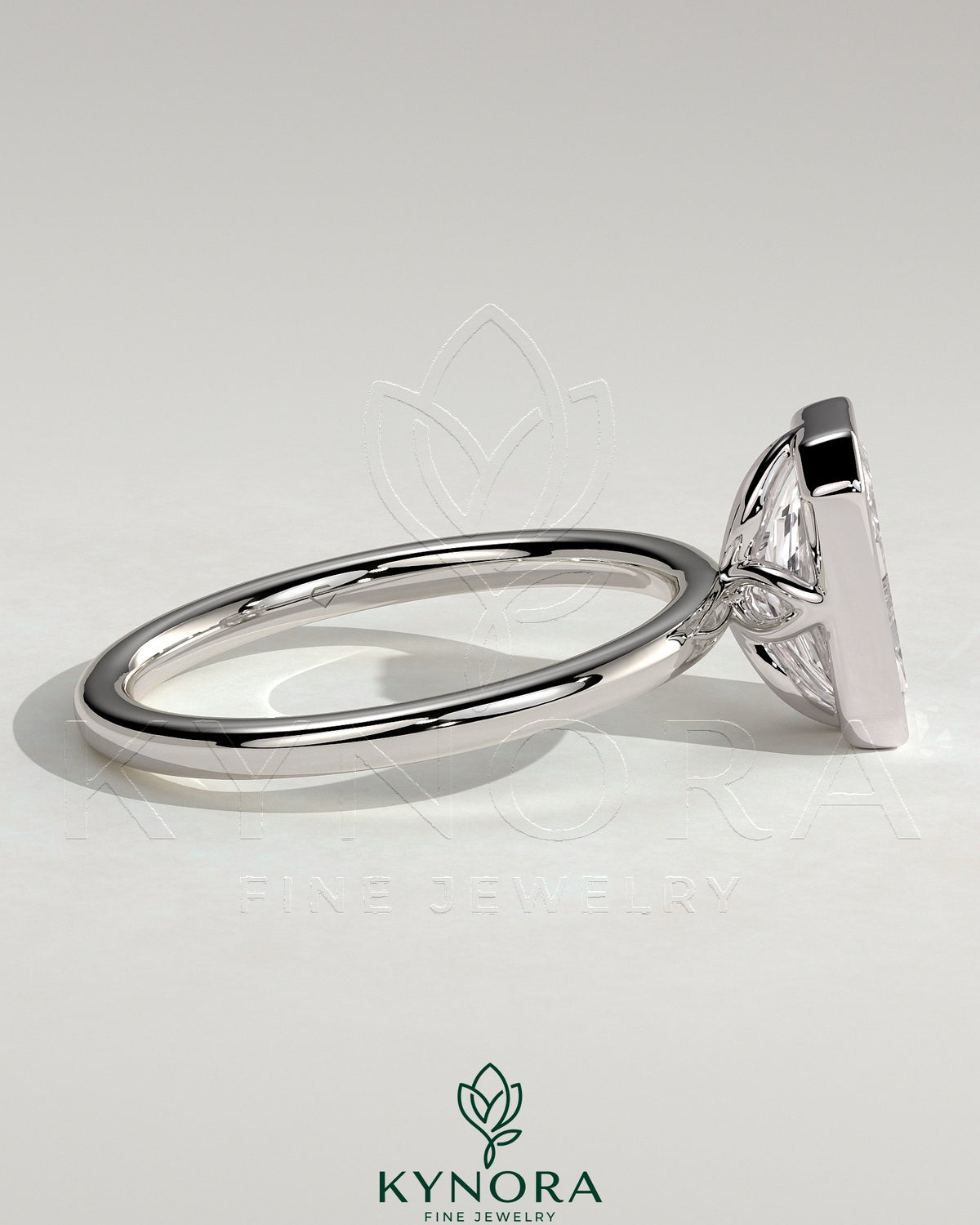 Kynora CJ 2ct radiant bezel solitaire engagement ring with petal gallery design, featuring a central radiant-cut diamond in a sleek bezel setting.