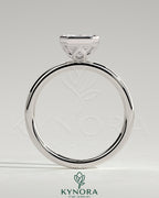Kynora CJ 2ct radiant bezel solitaire engagement ring with petal gallery design, featuring a central diamond and intricate band detail.