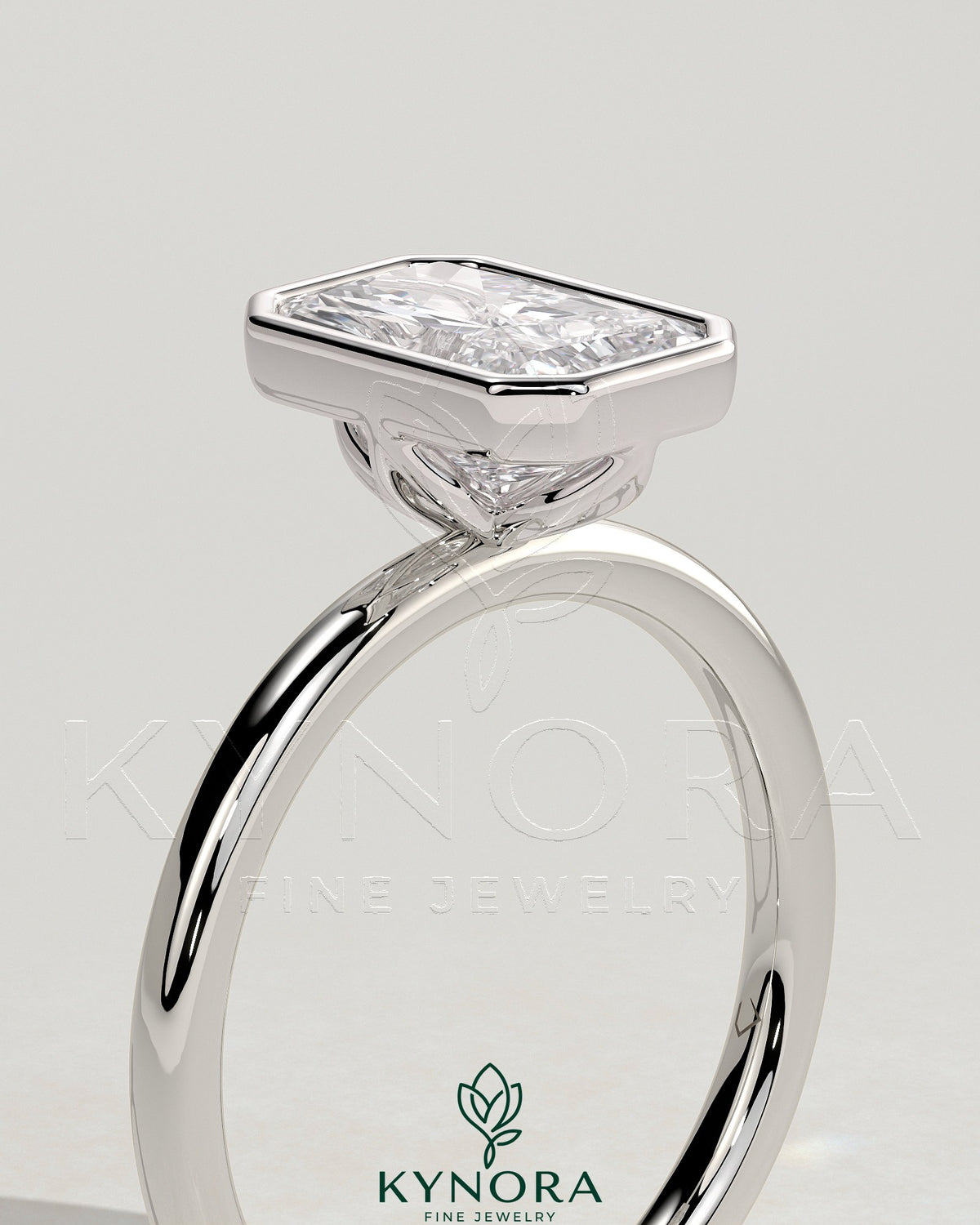 Kynora CJ 2ct Radiant Bezel Solitaire Engagement Ring with Petal Gallery design, featuring a radiant-cut center stone and intricate band.