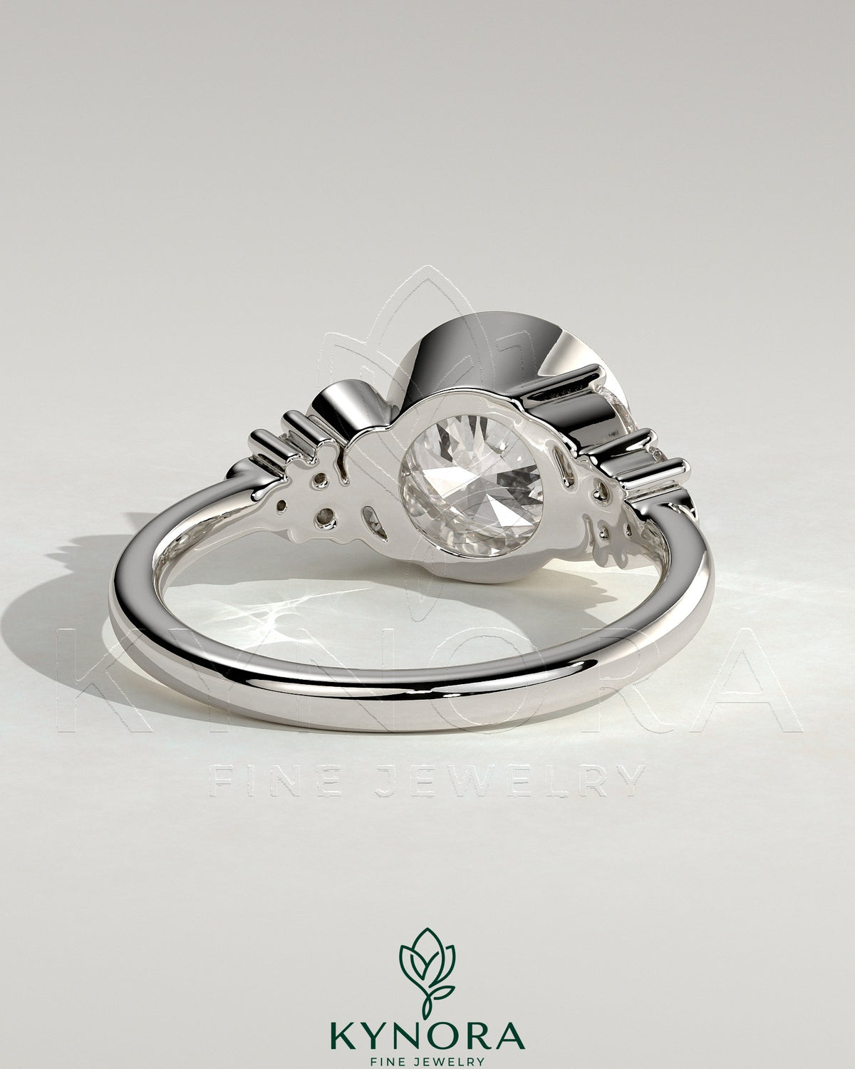 Kynora CJ 2ct round bezel solitaire engagement ring with clustered round and marquise shoulder stones, elegant jewelry design