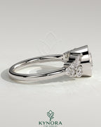 Kynora CJ 2ct bezel solitaire engagement ring with clustered round and marquise shoulder stones, elegant jewelry design