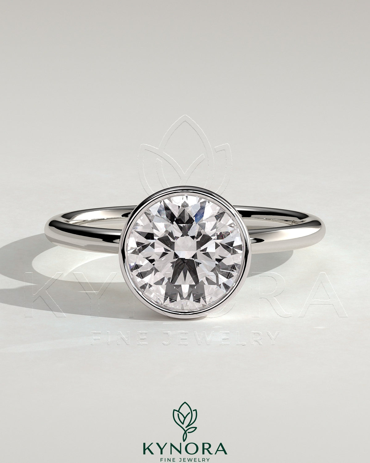 Kynora CJ 2ct round bezel solitaire engagement ring with petal gallery design, showcasing a sparkling diamond on a silver band. Main image