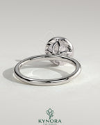 Kynora CJ 2ct round bezel solitaire engagement ring with petal gallery design in gold, showcasing elegant craftsmanship.