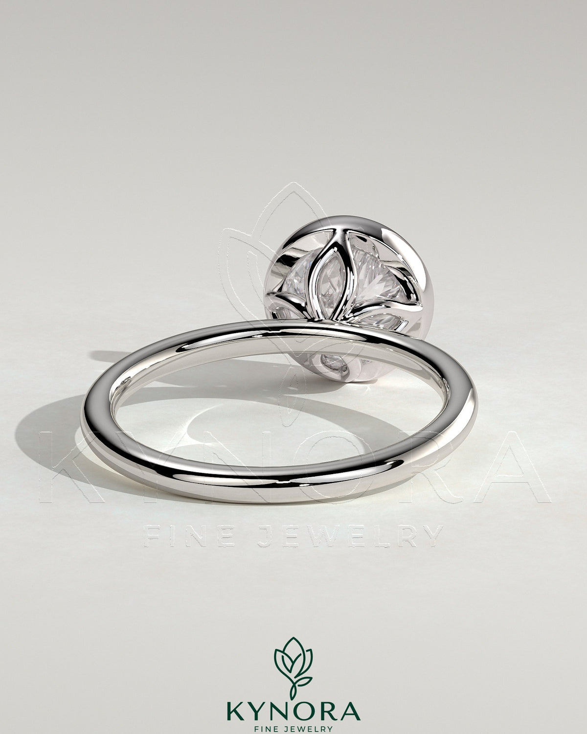 Kynora CJ 2ct round bezel solitaire engagement ring with petal gallery design in gold, showcasing elegant craftsmanship.