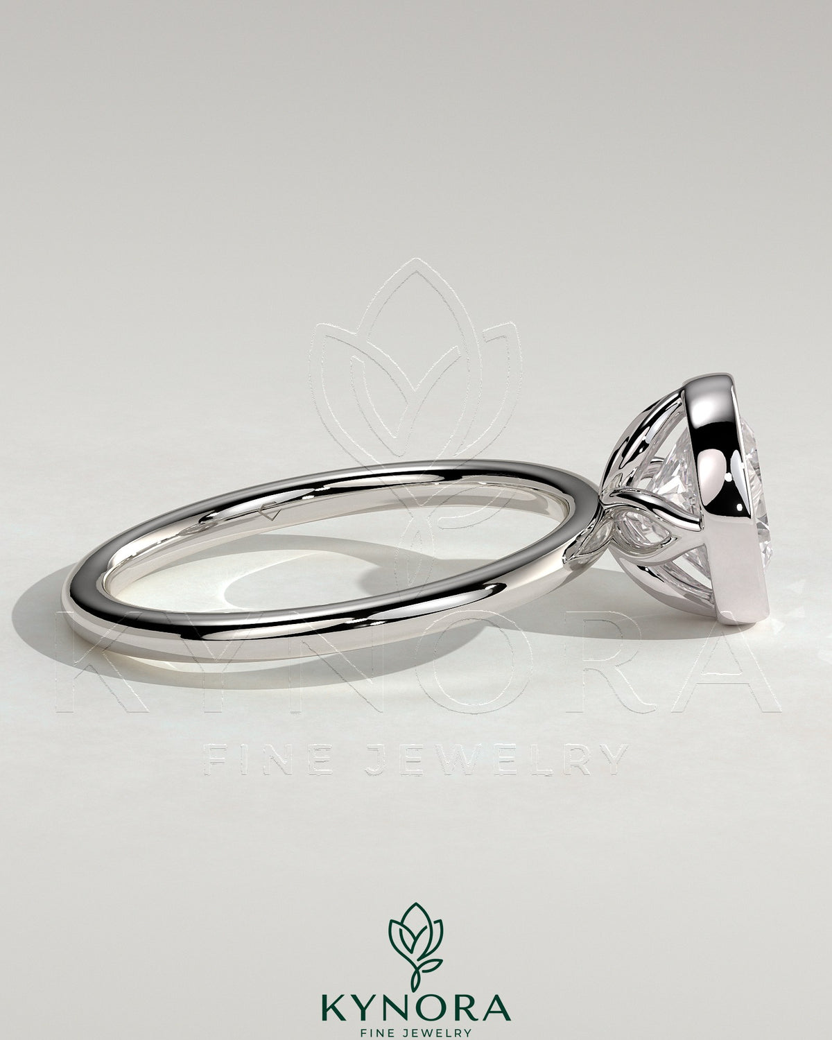 Kynora CJ 2ct round bezel solitaire engagement ring with petal gallery design in sleek gold setting.