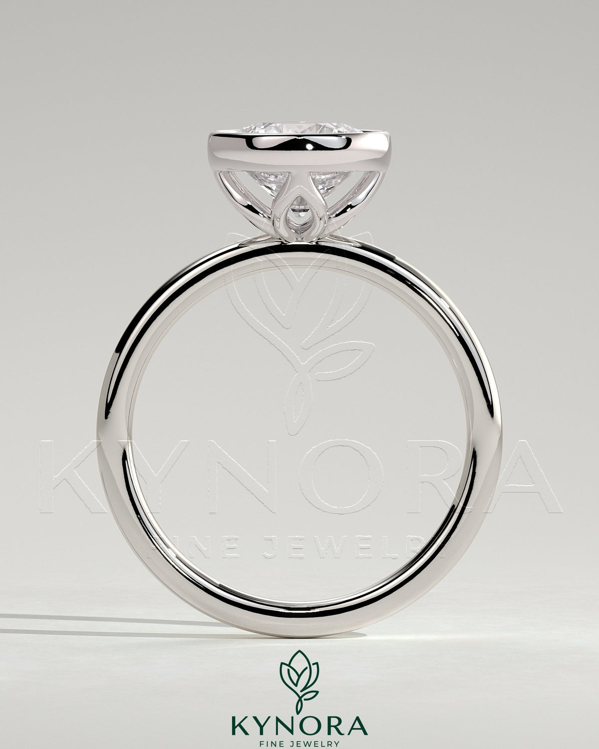 Kynora CJ 2ct round bezel solitaire engagement ring with petal gallery design, featuring a central diamond and intricate metalwork.