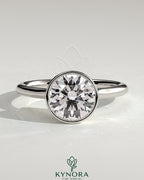 Kynora CJ 2ct round bezel solitaire engagement ring with twisted gallery design in sterling silver.