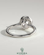 Kynora CJ 2ct round bezel solitaire engagement ring with twisted gallery design, showcasing a sparkling center stone and intricate band detail