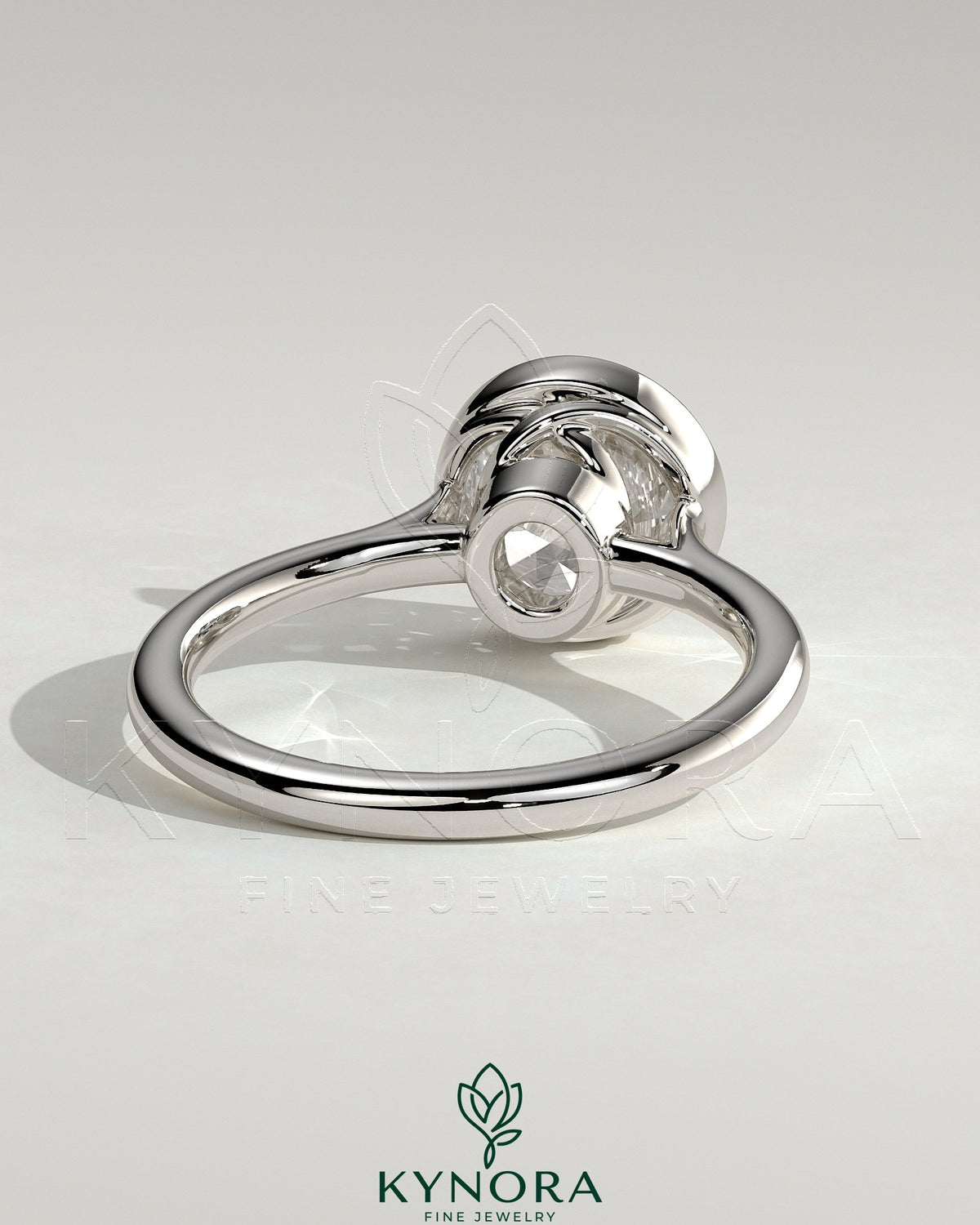 Kynora CJ 2ct round bezel solitaire engagement ring with twisted gallery design, showcasing a sparkling center stone and intricate band detail
