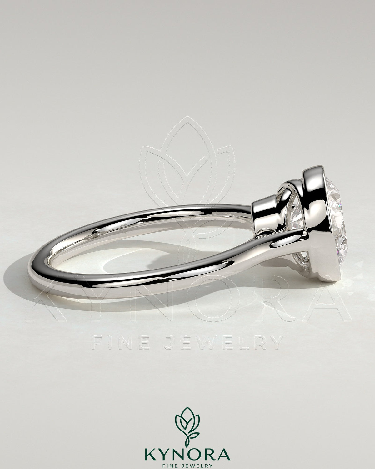 Kynora CJ 2ct round bezel solitaire engagement ring with twisted gallery design, showcasing the sparkling central diamond and intricate band.