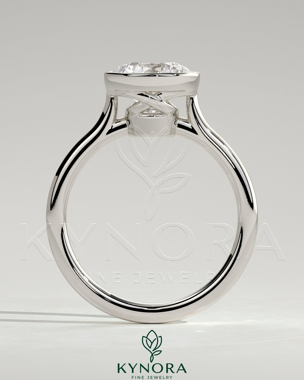 Kynora CJ 2ct round bezel solitaire engagement ring with twisted gallery design in a close-up view of the ring's intricate band and setting.