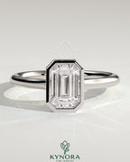 Kynora CJ statement 2ct emerald bezel solitaire engagement ring with open cathedral high setting, showcasing elegant design.