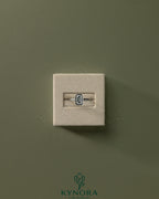 Kynora CJ statement 2ct emerald bezel solitaire engagement ring with open cathedral high setting and intricate band details.