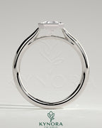 Kynora CJ statement 2ct emerald bezel solitaire engagement ring with open cathedral high setting, showcasing a vibrant green gemstone.