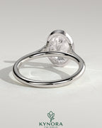 Kynora CJ statement 2ct oval bezel solitaire engagement ring with open cathedral high setting and elegant design.