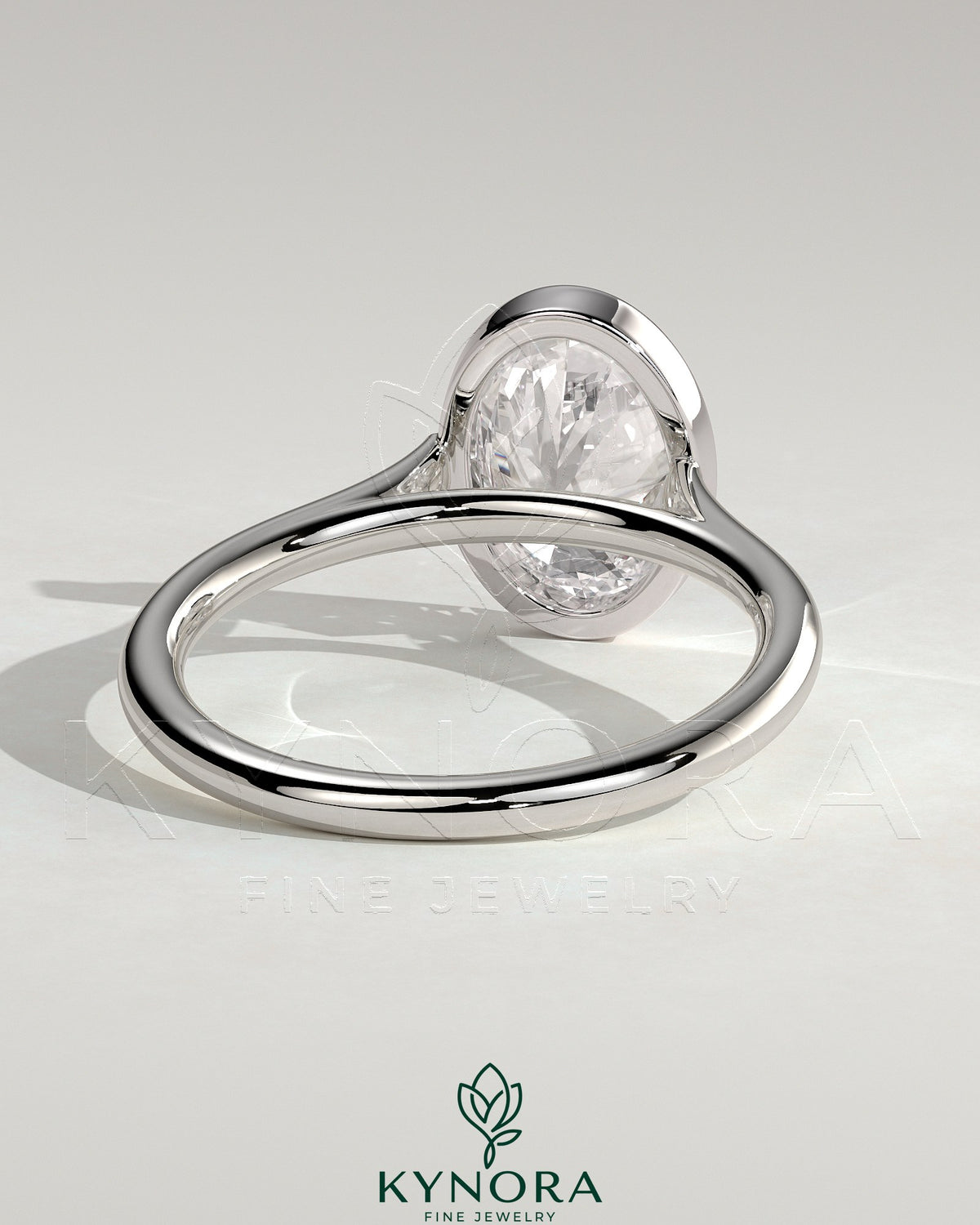 Kynora CJ statement 2ct oval bezel solitaire engagement ring with open cathedral high setting and elegant design.
