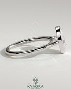 Kynora CJ statement 2ct oval bezel solitaire engagement ring with open cathedral high setting and elegant design.