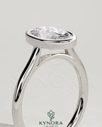 Kynora CJ Statement 2ct oval bezel solitaire engagement ring with open cathedral high setting and elegant design.