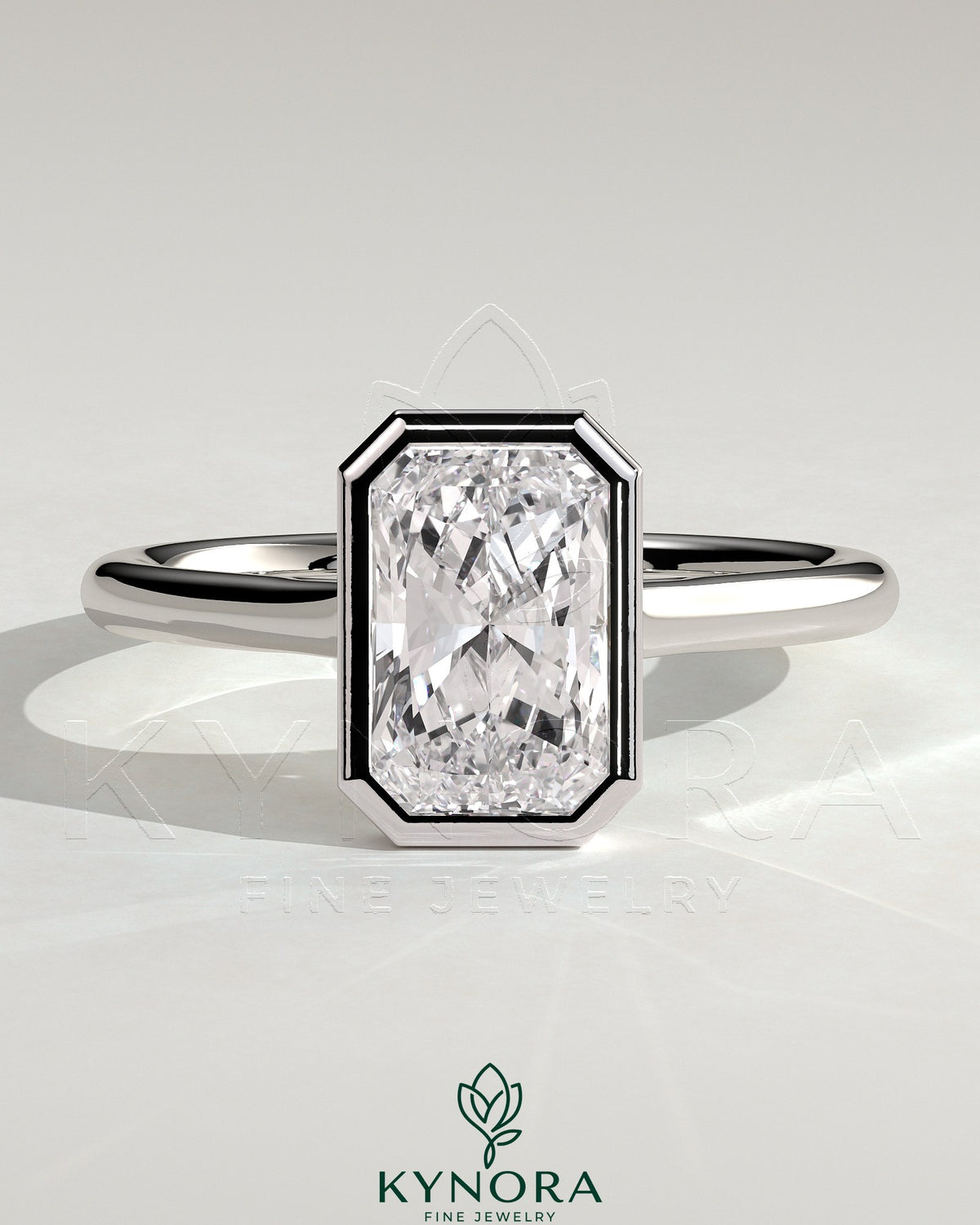 Kynora CJ statement 2ct radiant bezel solitaire engagement ring with open cathedral high setting and intricate band detail.