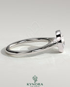 Kynora CJ statement 2ct round bezel solitaire engagement ring with open cathedral high setting, showcasing elegant jewelry design.