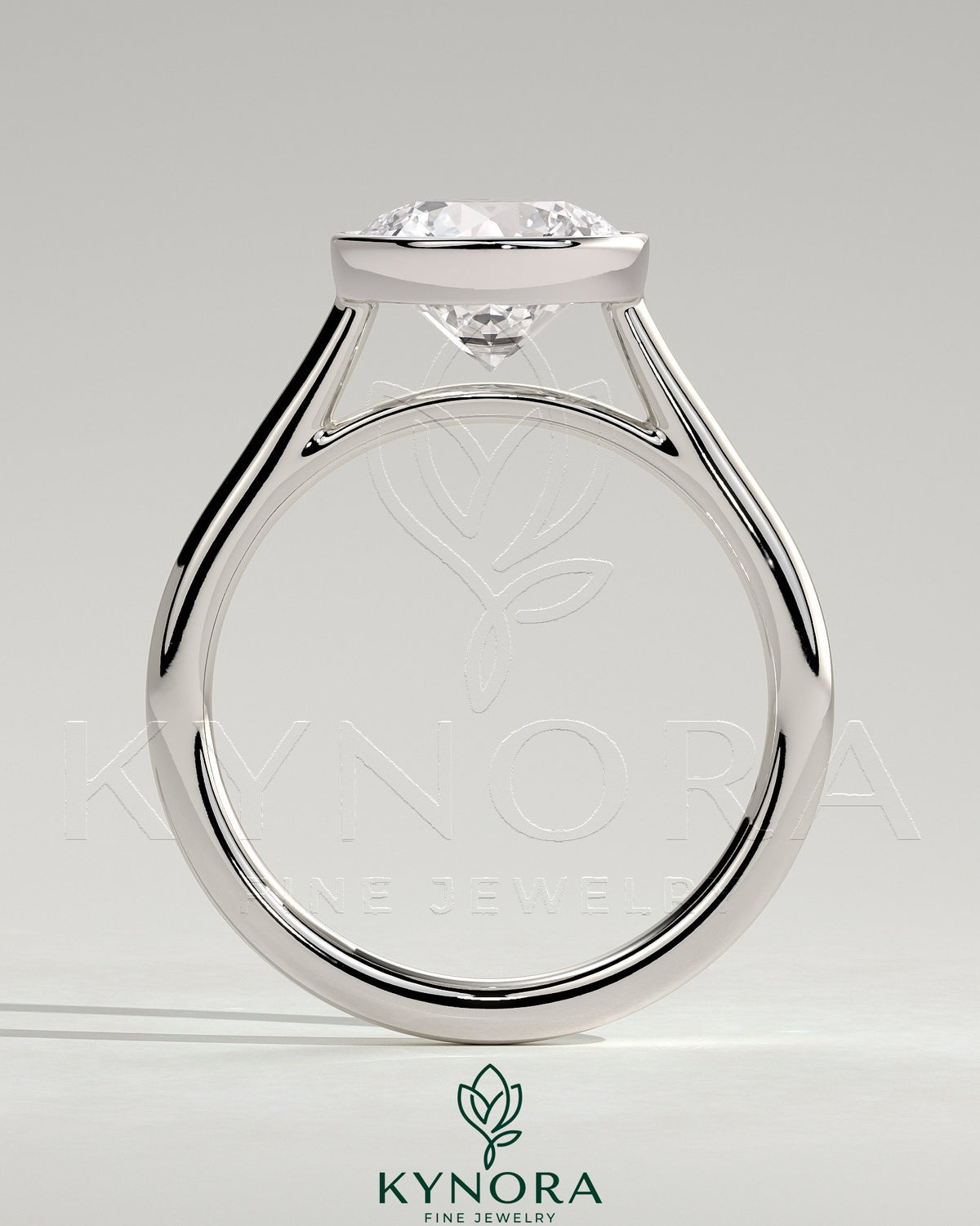 Kynora CJ statement 2ct round bezel solitaire engagement ring with open cathedral high setting and elegant design.