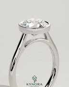 Kynora CJ statement 2ct round bezel solitaire engagement ring with open cathedral high setting, showcasing elegant jewelry design