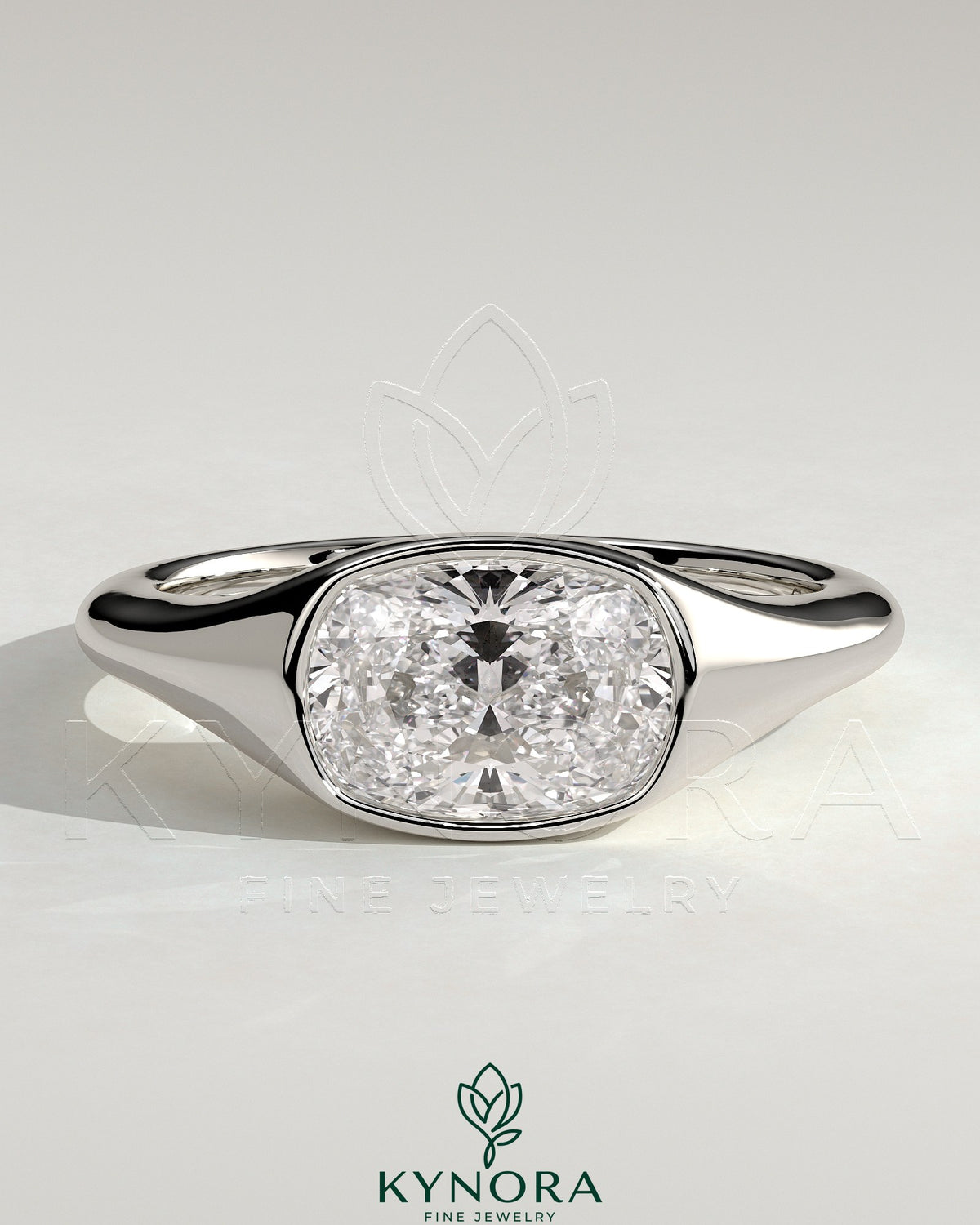 Kynora CJ 2ct elongated cushion cut diamond engagement ring with east-west bezel solitaire and signet band design.