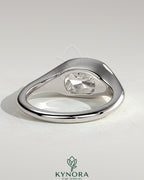 Kynora CJ 2ct elongated cushion cut diamond engagement ring with east-west bezel solitaire and signet band design.