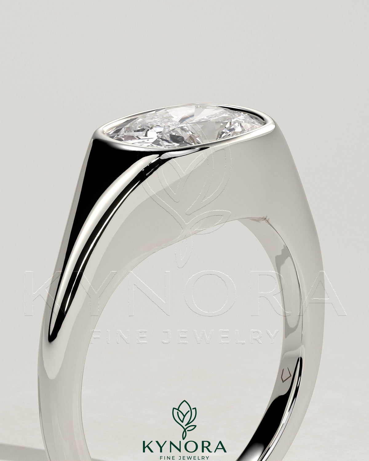 East-West 2ct cushion-cut diamond engagement ring with bezel setting and signet band by Kynora CJ, showcasing elegant jewelry craftsmanship.
