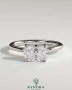 Kynora CJ 2-carat elongated cushion cut diamond engagement ring with east-west setting and claw prongs.