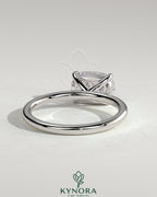 Kynora CJ 2ct elongated cushion cut diamond engagement ring with east-west setting and claw prongs on a sleek metal band