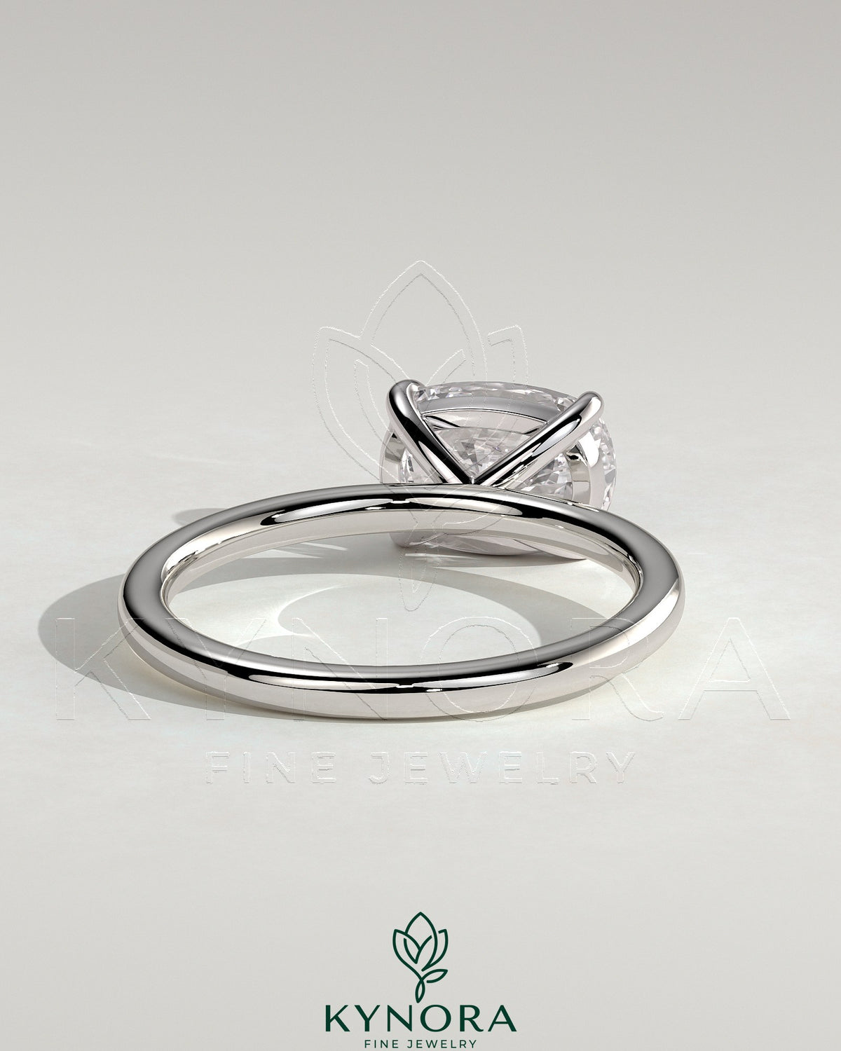 Kynora CJ 2ct elongated cushion cut diamond engagement ring with east-west setting and claw prongs on a sleek metal band