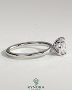 Kynora CJ 2ct elongated cushion cut diamond engagement ring with east-west setting and claw prongs.