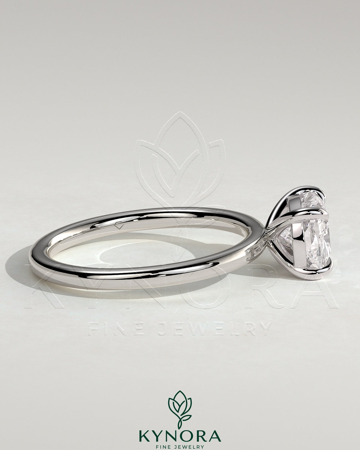 Kynora CJ 2ct elongated cushion cut diamond engagement ring with east-west setting and claw prongs.