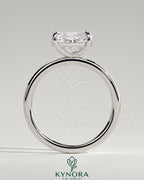 Kynora CJ 2ct elongated cushion cut diamond engagement ring with east-west setting and claw prongs, elegant and sparkling jewelry piece.