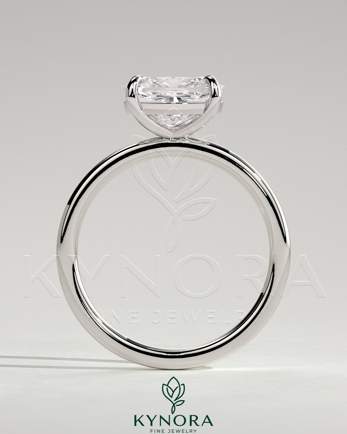 Kynora CJ 2ct elongated cushion cut diamond engagement ring with east-west setting and claw prongs, elegant and sparkling jewelry piece.
