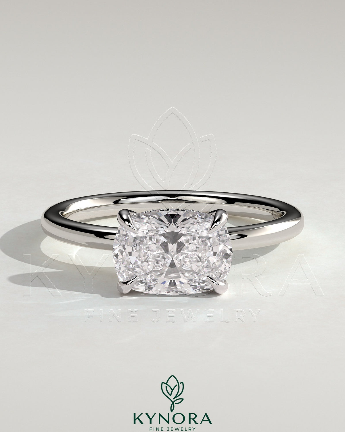 Kynora CJ 2ct elongated East-West cushion solitaire engagement ring with hidden halo and claw setting, showcasing elegant jewelry design.