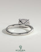 Kynora CJ 2ct elongated East-West cushion solitaire engagement ring with hidden halo and claw setting, showcasing elegant jewelry design.