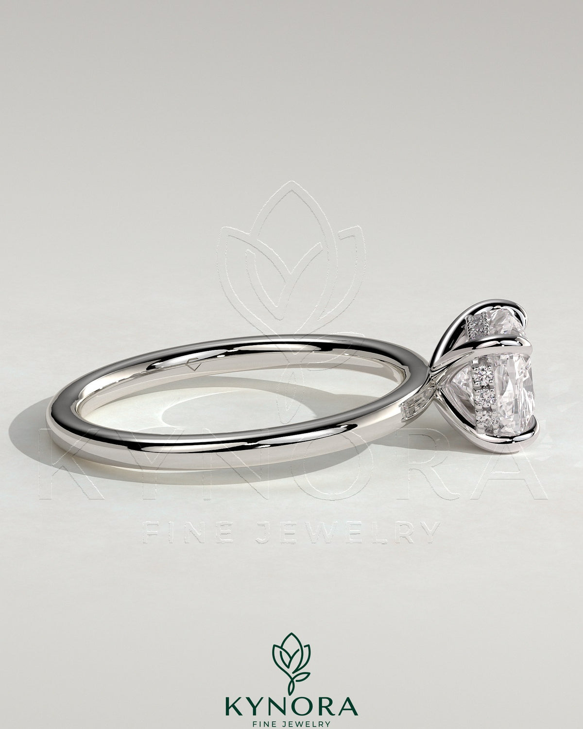 Kynora CJ 2ct elongated East-West cushion cut engagement ring with hidden halo and claw setting, showcased on a white background.