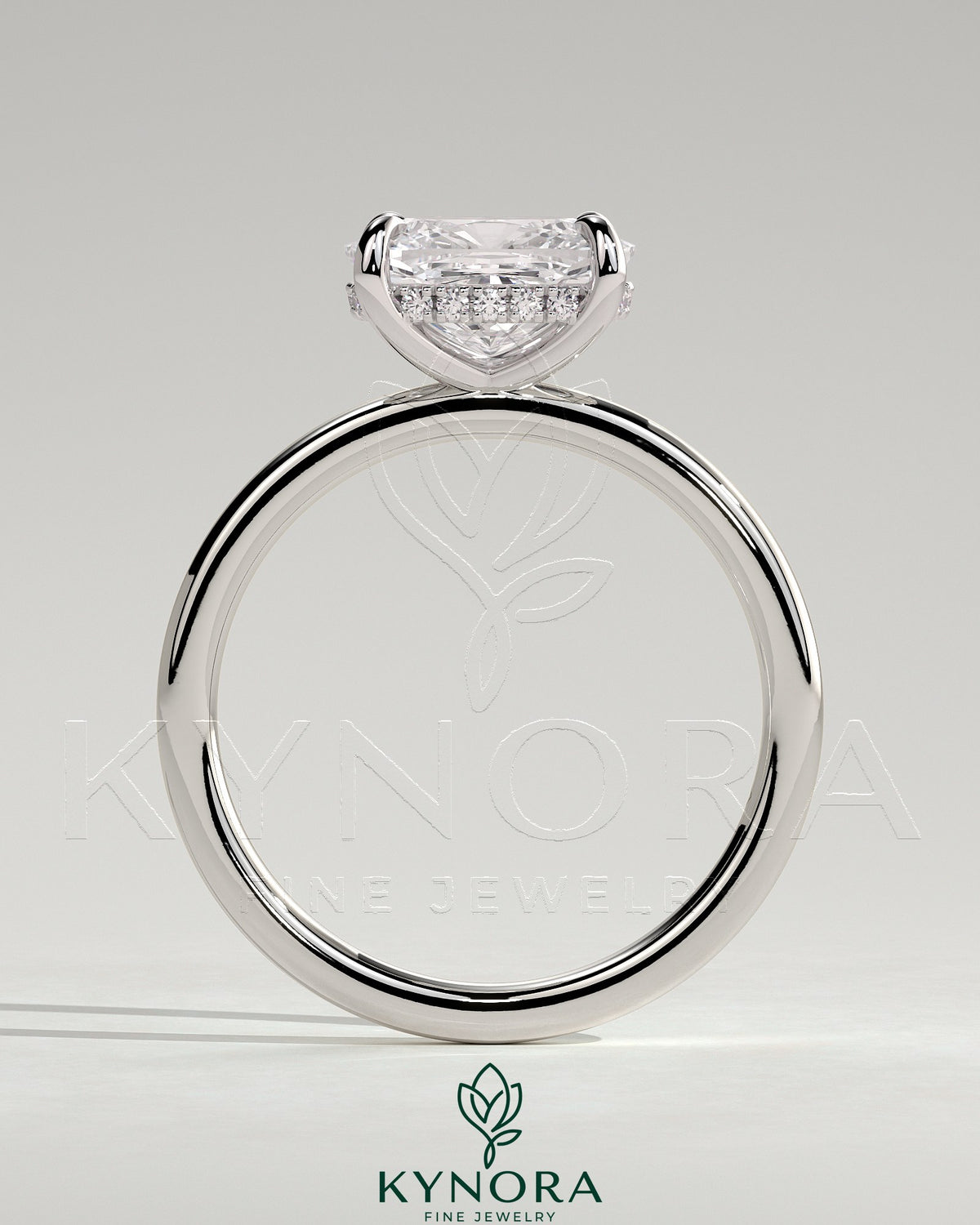 Elegant 2ct East-West cushion-shaped diamond engagement ring with hidden halo and claw setting by Kynora CJ.