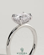 Kynora CJ 2ct elongated east-west cushion cut engagement ring with hidden halo and claw setting, showcasing elegant jewelry craftsmanship.