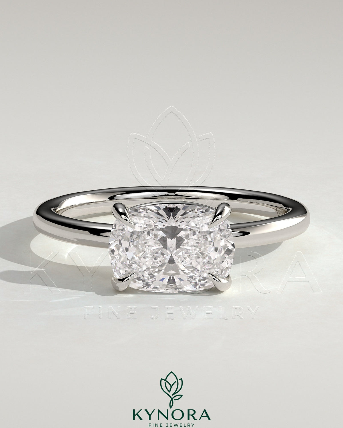 Kynora CJ 2ct elongated cushion East-West claw solitaire engagement ring with raised basket gallery, sparkling diamond setting.