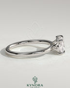 Kynora CJ 2ct elongated cushion cut diamond engagement ring with east-west setting and raised basket gallery design.