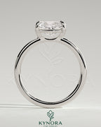 Kynora CJ 2-carat elongated east-west claw solitaire engagement ring with raised basket gallery, sparkling diamond setting.