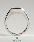 East-West 2ct emerald engagement ring by Kynora CJ featuring a bezel solitaire setting and signet band design.