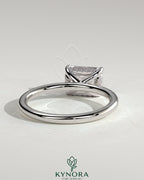 Kynora CJ 2ct emerald-cut east-west claw solitaire engagement ring with hidden halo, featuring a stunning emerald gemstone.