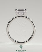 Kynora CJ 2ct emerald cut east-west claw solitaire engagement ring with hidden halo, showcasing a sparkling center stone and elegant design.