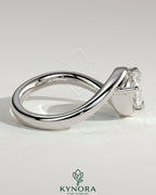 Kynora CJ 2ct marquise east-west claw solitaire engagement ring with bypass band, featuring a sparkling marquise-cut diamond.
