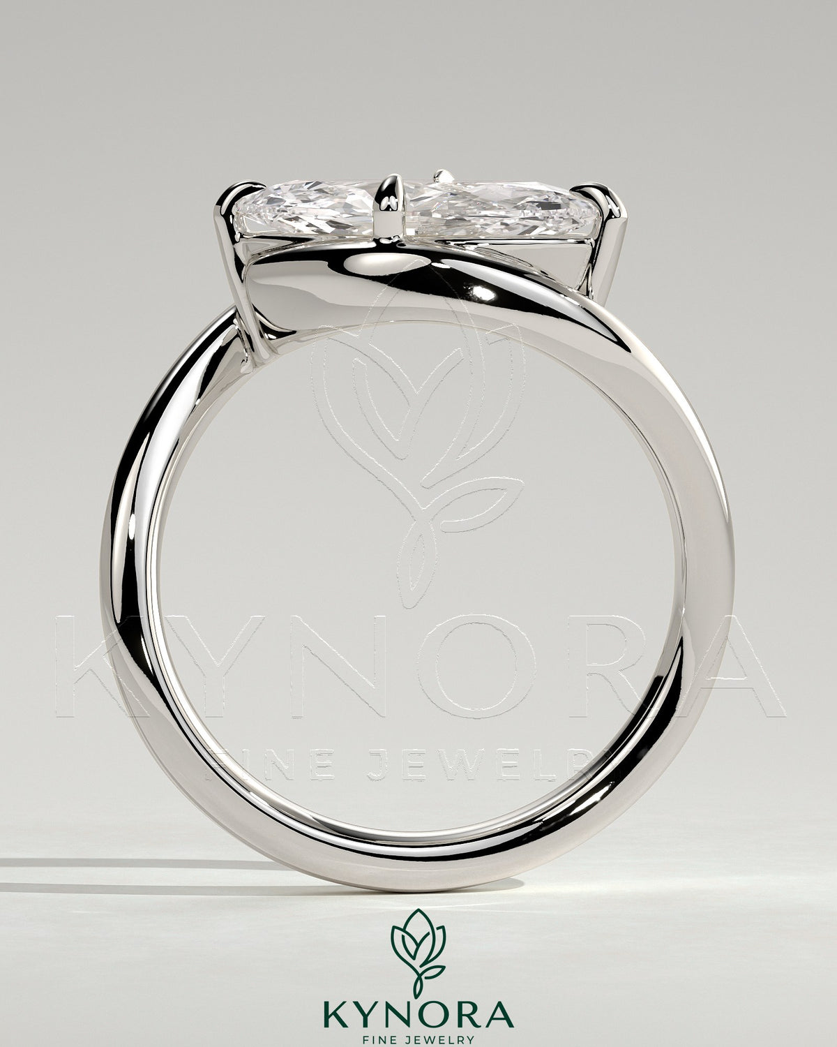 Kynora CJ 2ct marquise east-west claw solitaire engagement ring with bypass band, showcasing a sparkling marquise diamond.